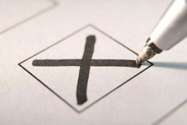 Vote A pen marking an X vote in a box